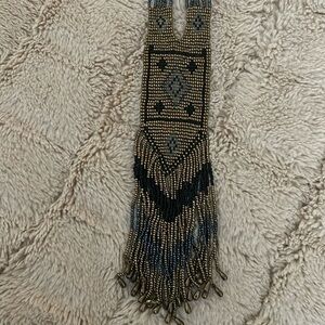 Beaded necklace.  Black, silver and gold. 20 inch hang from neck to bottom.